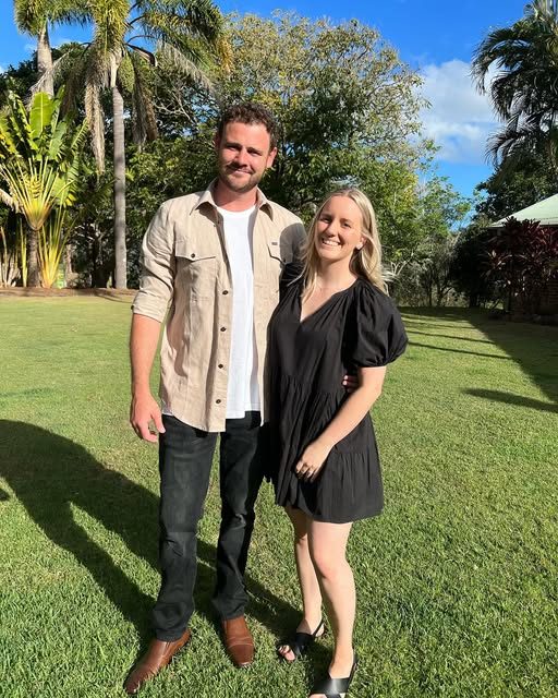 Joshua and Kate standing on a lawn